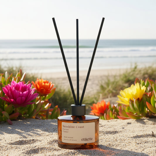 Reed diffuser with black sticks on a Beach 